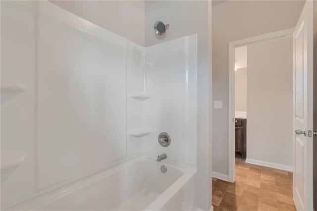 2320 Ivy Birch Ln, Buford, GA 30519 - full bathroom featuring shower / bath combination, baseboards, and vanity