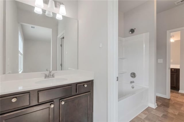 2320 Ivy Birch Ln, Buford, GA 30519 - full bathroom with vanity, washtub / shower combination, and baseboards