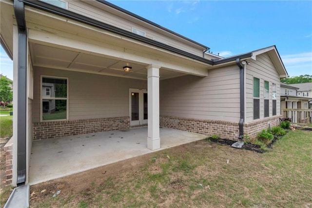 2320 Ivy Birch Ln, Buford, GA 30519 - back of property featuring brick siding, a patio, and a lawn