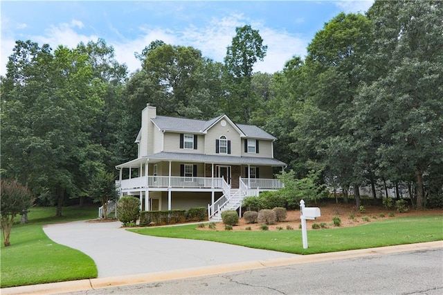 89 Paul Cir, Jasper, GA 30143 - view of front facade featuring covered porch, stairs, a front yard, and concrete driveway