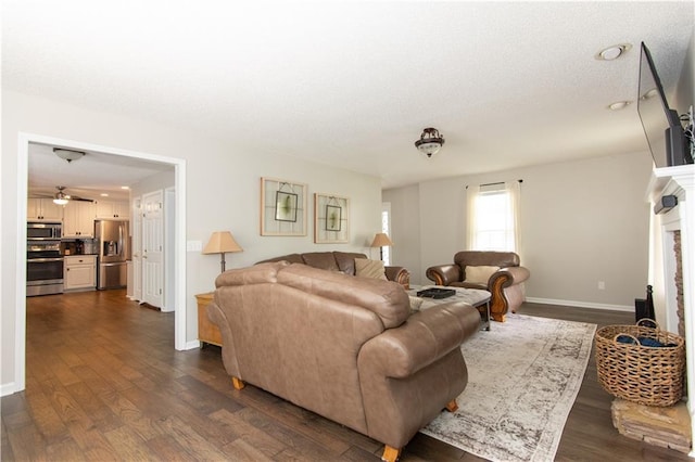 89 Paul Cir, Jasper, GA 30143 - living room featuring dark wood finished floors, ceiling fan, and a fireplace