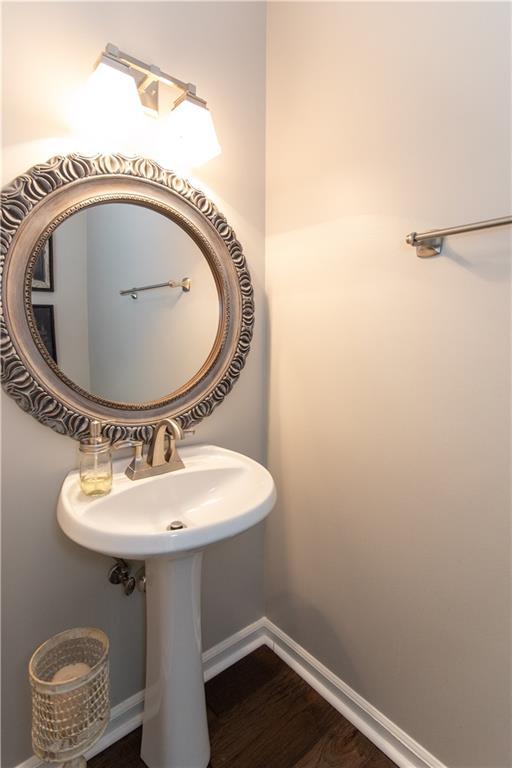 89 Paul Cir, Jasper, GA 30143 - bathroom with baseboards and wood finished floors