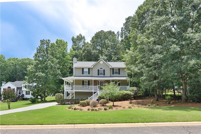 89 Paul Cir, Jasper, GA 30143 - view of front facade with covered porch, driveway, a chimney, and a front lawn
