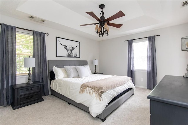 89 Paul Cir, Jasper, GA 30143 - bedroom featuring a raised ceiling, light carpet, multiple windows, and ceiling fan