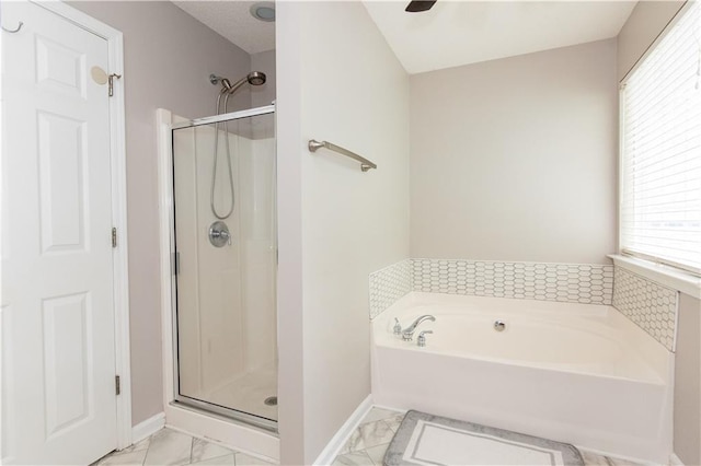 89 Paul Cir, Jasper, GA 30143 - full bathroom featuring marble finish flooring, a stall shower, a garden tub, and ceiling fan
