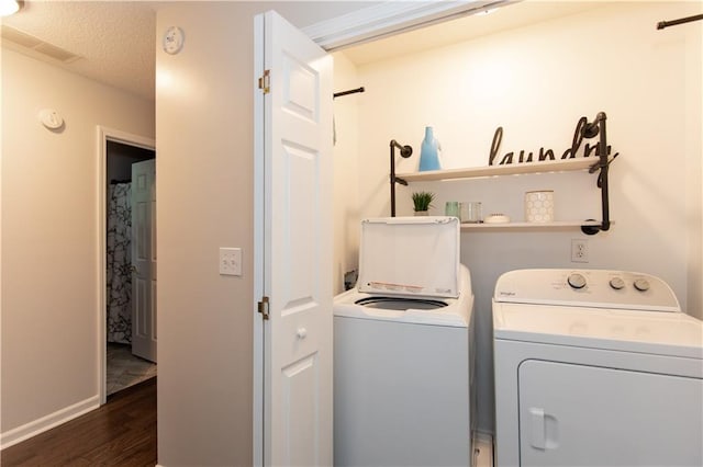 89 Paul Cir, Jasper, GA 30143 - laundry room with washing machine and clothes dryer, dark wood finished floors, and a textured ceiling