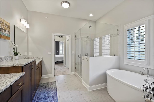 bathroom featuring separate shower and tub, vanity, plenty of natural light, and tile patterned floors