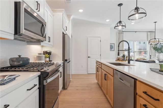 432 Carrera Ln, Acworth, GA 30102 - kitchen featuring a sink, light wood-style floors, light countertops, stainless steel appliances, and decorative backsplash