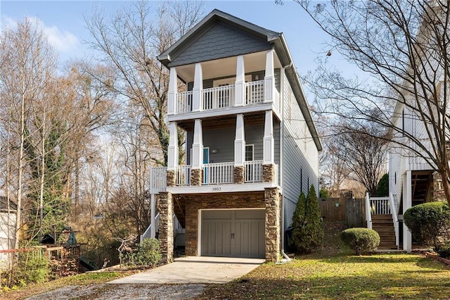 view of front of property with a garage and a front lawn