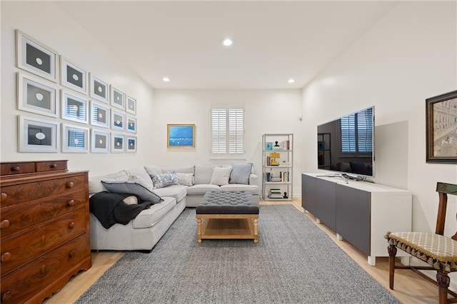 living room with recessed lighting and light wood-style floors