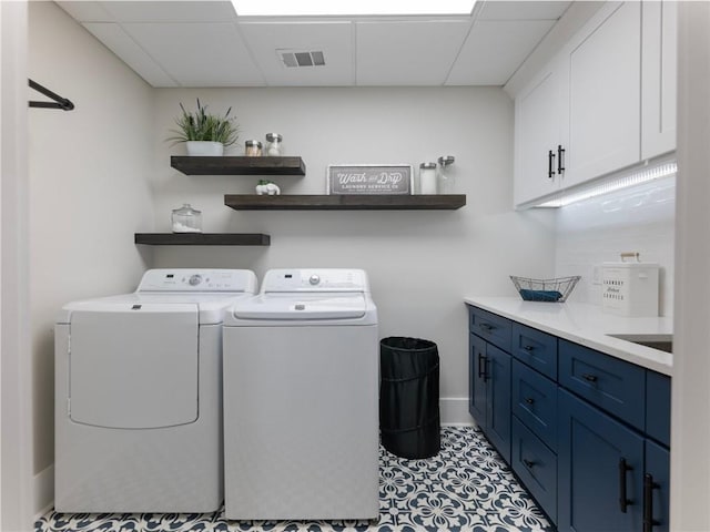 laundry area featuring cabinets and washer and dryer