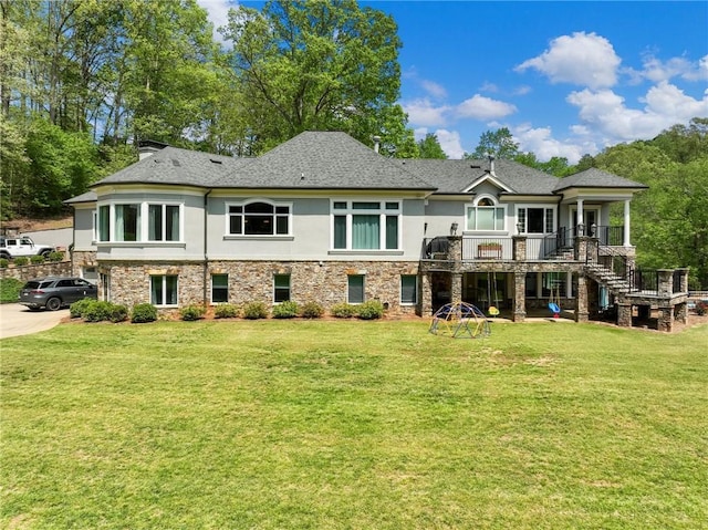 rear view of house with a lawn