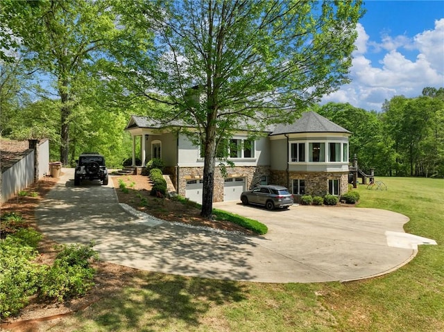 view of front of property featuring a garage and a front lawn