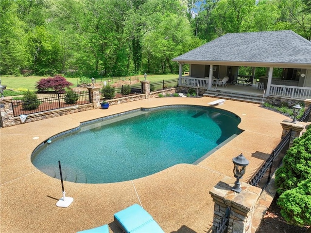 view of pool with a gazebo, a diving board, and a patio area