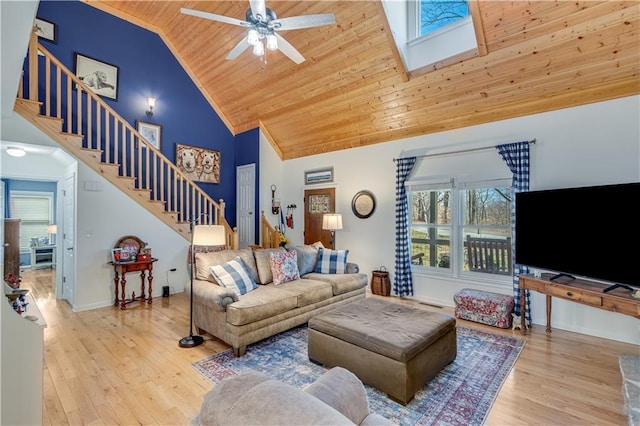 living room featuring stairway, high vaulted ceiling, wood ceiling, and wood finished floors