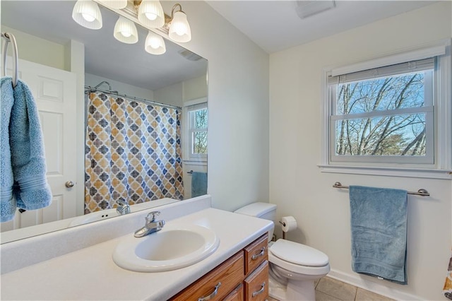 full bathroom with tile patterned floors, a shower with curtain, toilet, and vanity