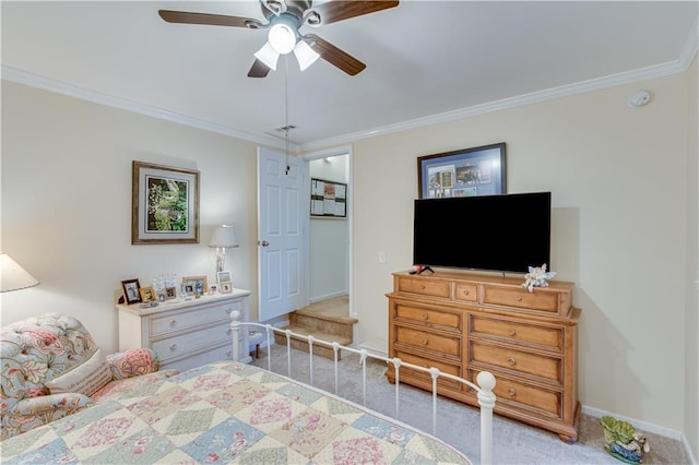 bedroom featuring visible vents, ornamental molding, carpet floors, baseboards, and ceiling fan