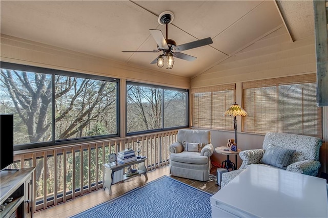 sunroom with ceiling fan and lofted ceiling