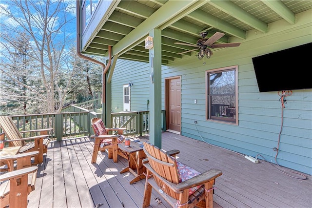 wooden terrace with a ceiling fan