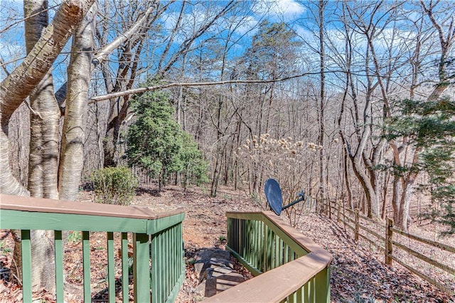 view of yard with a view of trees