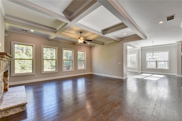 unfurnished living room featuring coffered ceiling, a stone fireplace, ornamental molding, dark hardwood / wood-style floors, and beam ceiling