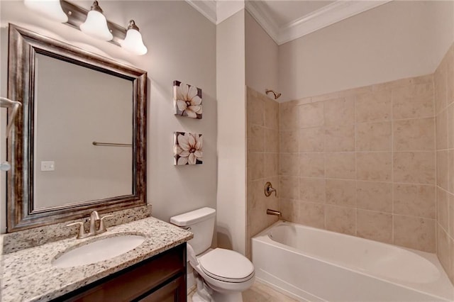 full bathroom with crown molding, vanity, tiled shower / bath combo, and toilet