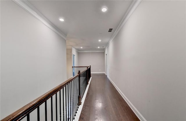 hall with ornamental molding and dark hardwood / wood-style flooring