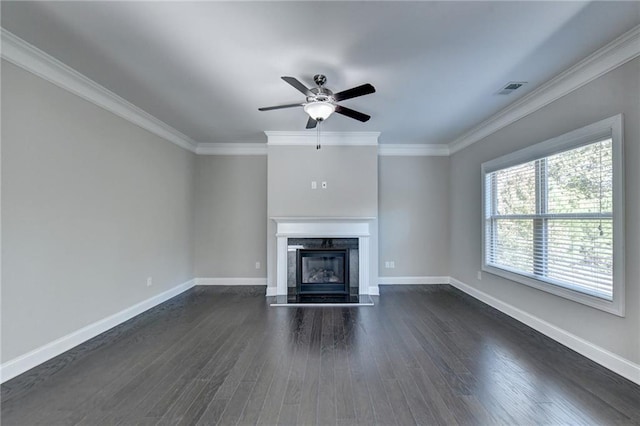 unfurnished living room featuring dark wood-type flooring, ornamental molding, and a high end fireplace