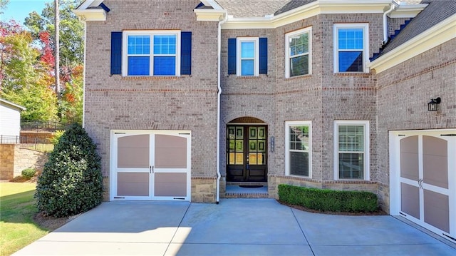 view of front of home with french doors and a garage