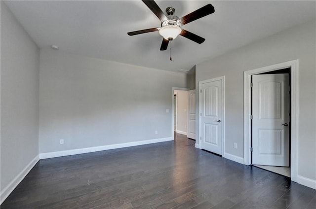 unfurnished bedroom featuring dark wood-type flooring and ceiling fan