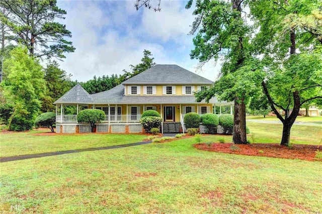 5179 Beech Forest Dr, Lilburn, GA 30047 - view of front facade with covered porch and a front lawn