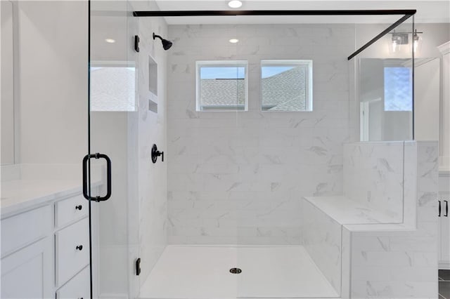 full bath featuring a shower stall and vanity