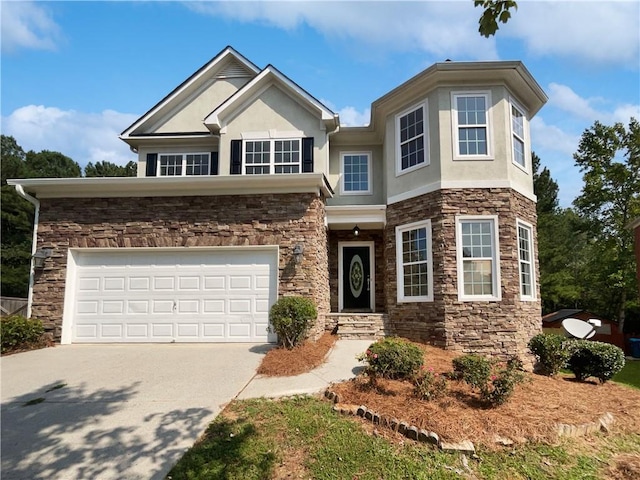 view of front of home with a garage, driveway, stone siding, and stucco siding