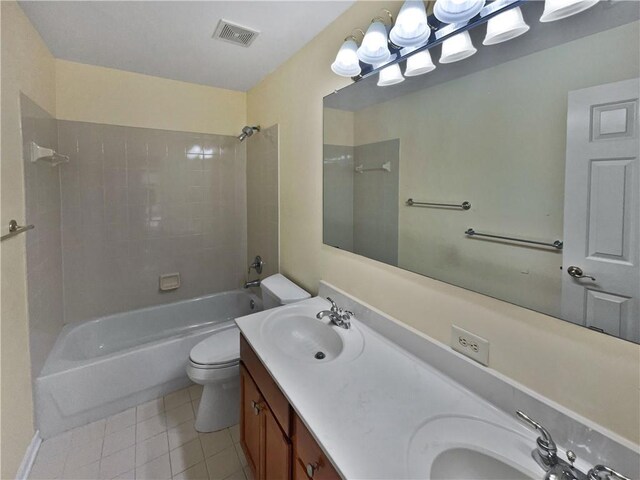 full bathroom featuring toilet, bathing tub / shower combination, a sink, and visible vents