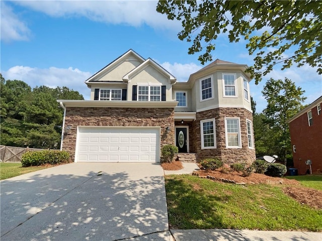 view of front facade featuring concrete driveway, stone siding, an attached garage, fence, and stucco siding