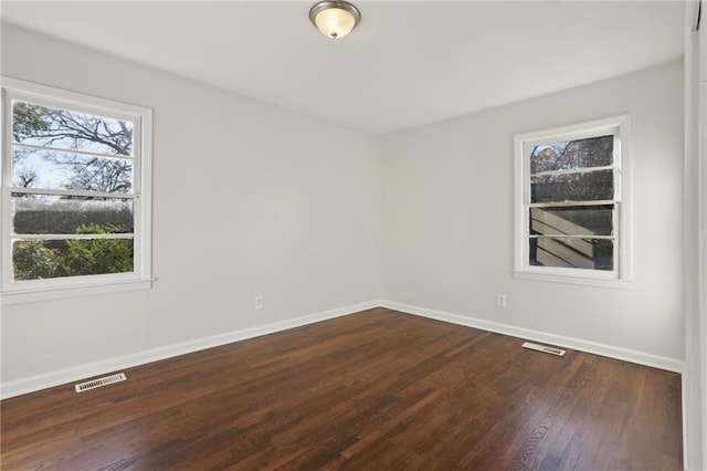 empty room featuring dark hardwood / wood-style floors