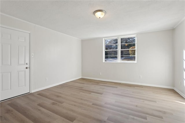 unfurnished room featuring light hardwood / wood-style flooring and plenty of natural light