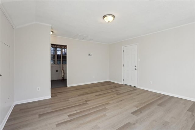 unfurnished room featuring light hardwood / wood-style floors and ornamental molding