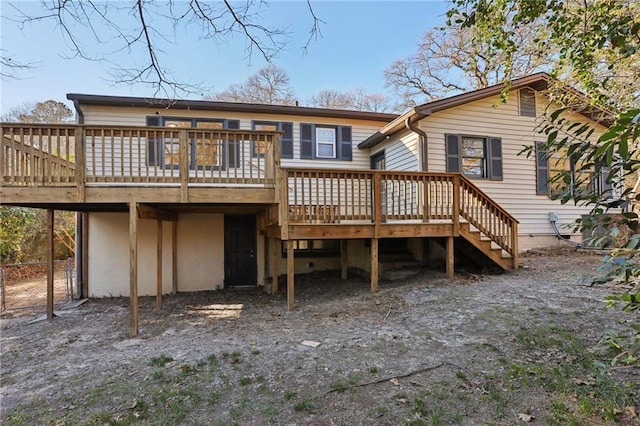 back of property with a wooden deck