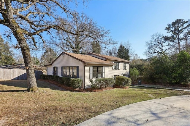 view of side of property with a yard