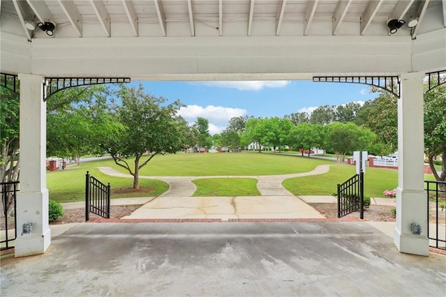 view of home's community with a yard
