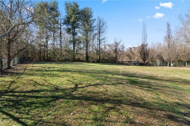 view of yard featuring fence