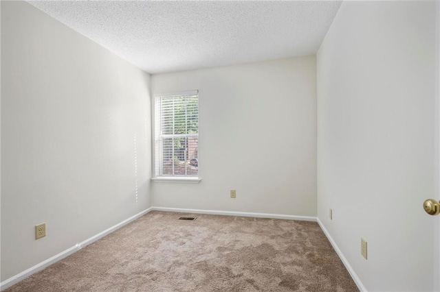 2117 Bucktrout Pl, Dunwoody, GA 30338 - empty room with carpet, a textured ceiling, and baseboards