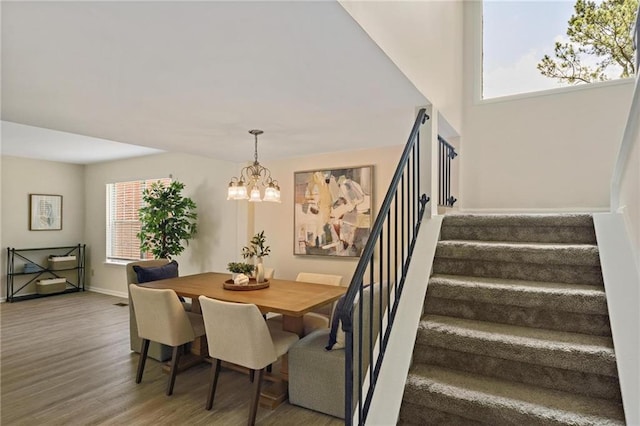 2117 Bucktrout Pl, Dunwoody, GA 30338 - dining room with stairway, wood finished floors, a chandelier, and baseboards