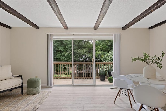 2117 Bucktrout Pl, Dunwoody, GA 30338 - interior space with beamed ceiling, light wood-type flooring, a textured ceiling, and baseboards