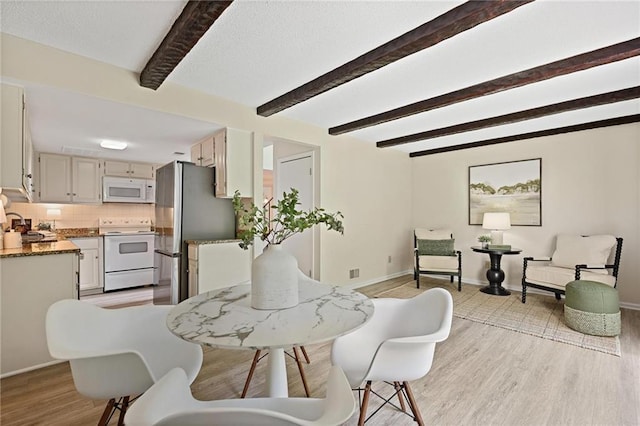 2117 Bucktrout Pl, Dunwoody, GA 30338 - dining space featuring beamed ceiling, light wood-style floors, and baseboards