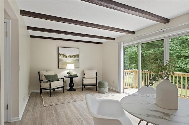 2117 Bucktrout Pl, Dunwoody, GA 30338 - living area with beamed ceiling, light wood-type flooring, and baseboards