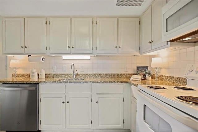 2117 Bucktrout Pl, Dunwoody, GA 30338 - kitchen featuring white appliances, a sink, white cabinets, tasteful backsplash, and light stone countertops