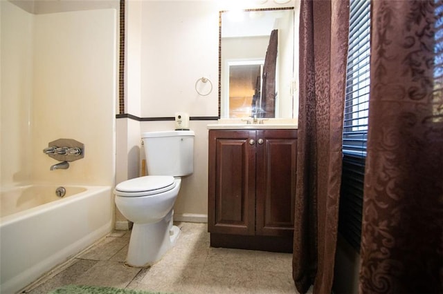 full bathroom featuring vanity, toilet,  shower combination, and tile patterned flooring