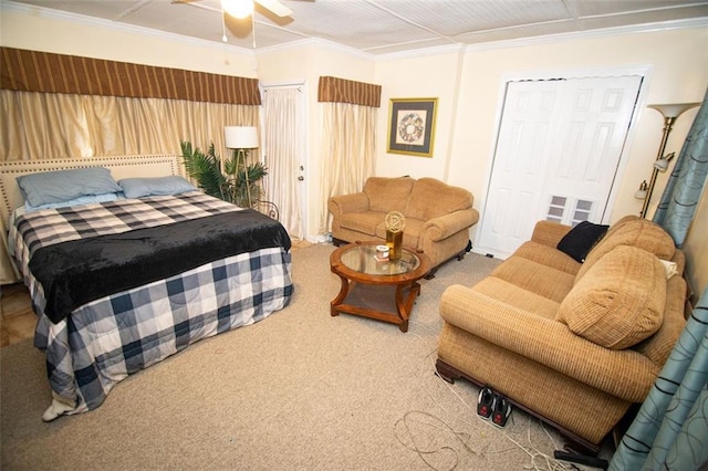 bedroom featuring crown molding, a closet, carpet flooring, and ceiling fan